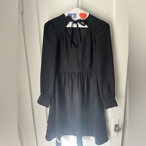 Kate Spade long sleeve black dress. Tie at neck size 4